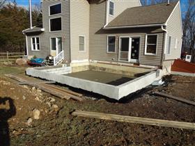 Addition being built!   Customer wanted to remove deck and add on an Addition which included sunroom, laundry room & bathroom.: 