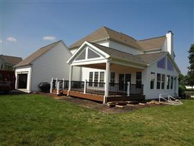 *AFTER* Side view of new deck & sunroom.  Notice to the trapezoid windows in deck & sunroom gable ends.: 