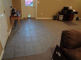 *After* - Doorway to outside.  Finished off with tile so no dirt gets tracked in on the carpet.: 